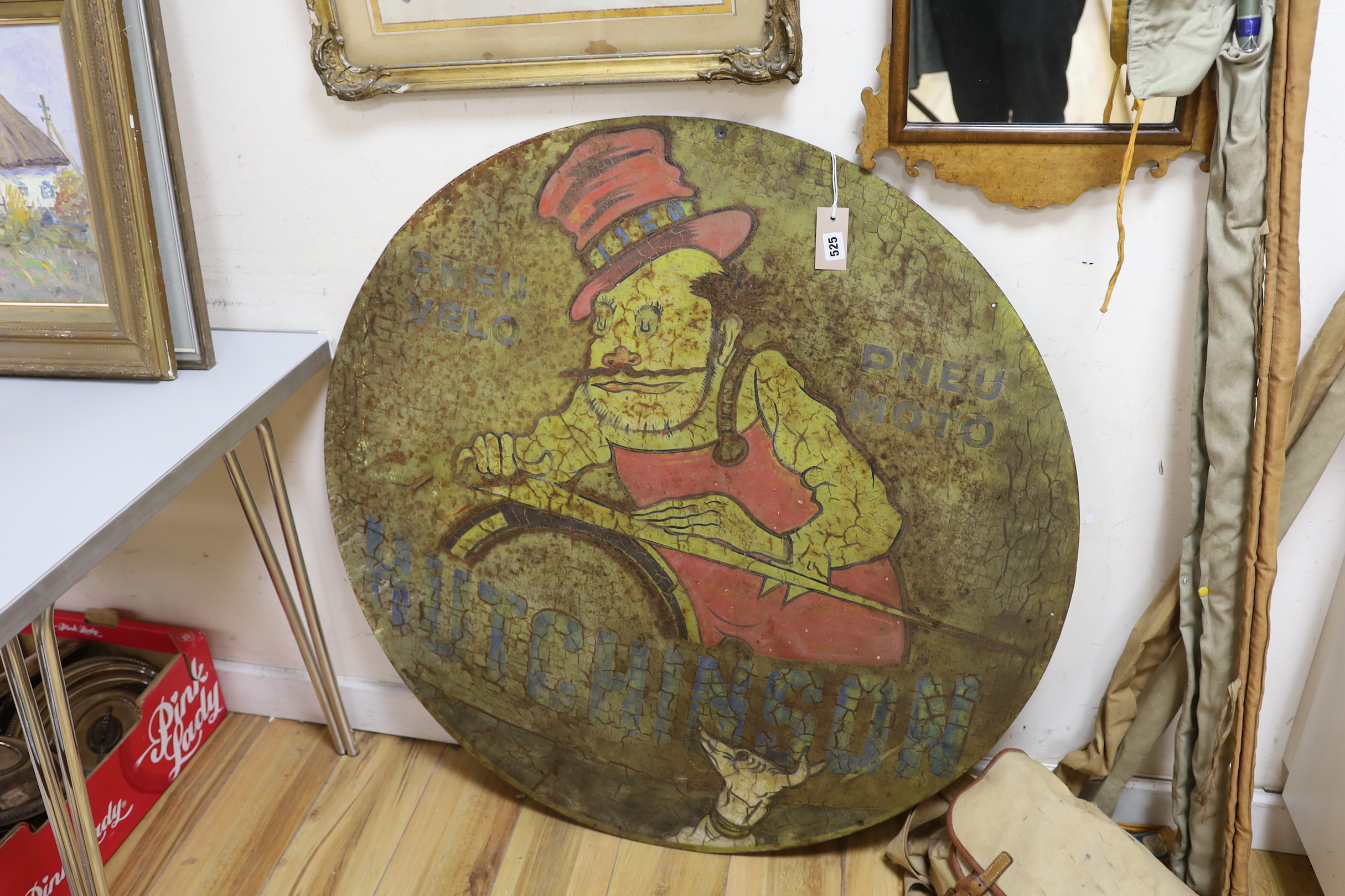 A circular painted metal Hutchinson Tyres advertising sign, 99cm diameter